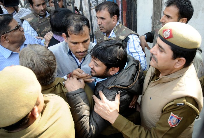 Kanhaiya Kumar, head of the student's union at Delhi's Jawaharlal Nehru University is escorted by police outside the Patiala House court in New Delhi